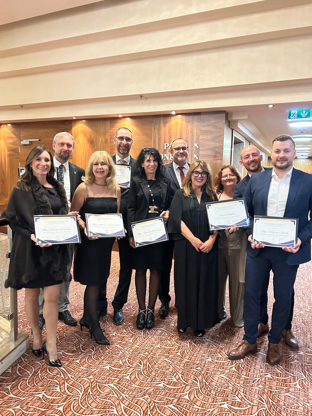 IRC graduates holding their certificates at the NARKS & Ta3 Gala